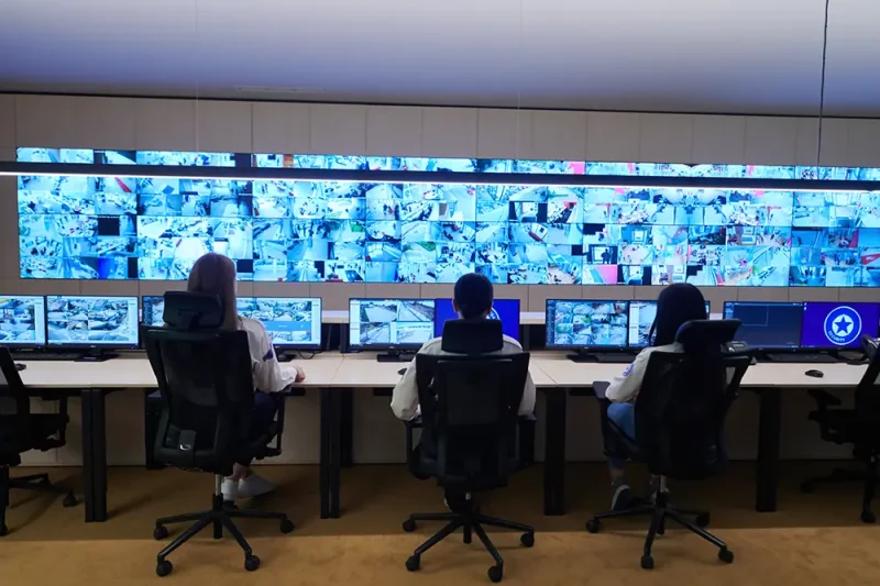 group-security-data-center-operators-working-cctv-monitoring-room-looking-multiple-monitors-officers-monitoring-multiple-screens-suspicious-activities-team-working-system-contr